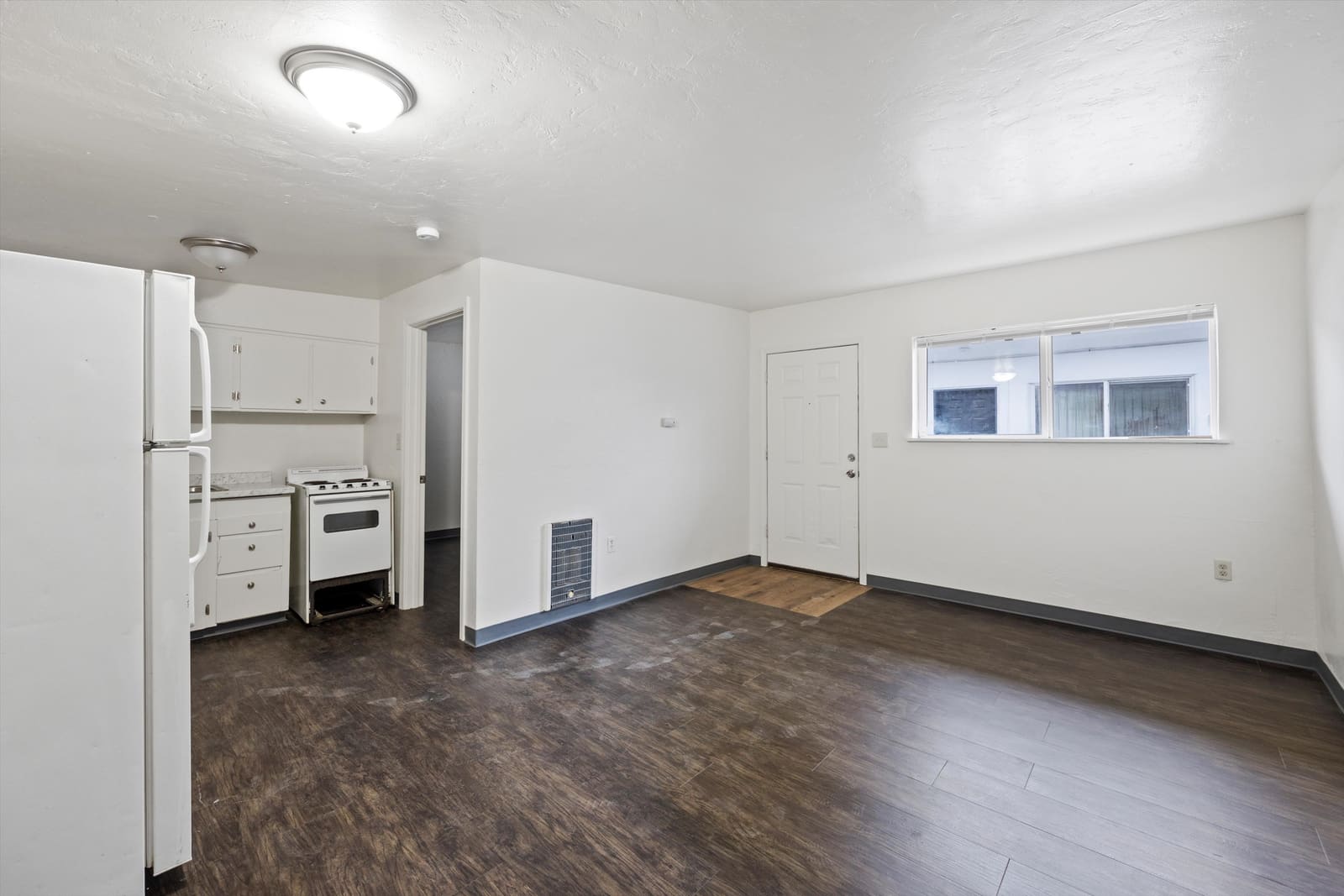 Renovated apartment interior with new flooring at the 12-unit Moses Lake property